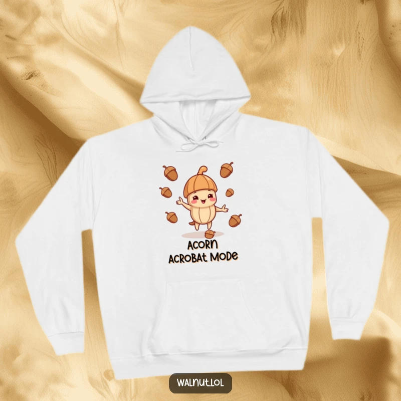 Funny hoodie showcasing a walnut wearing a jaunty cap, playfully juggling acorns with impressive coordination.