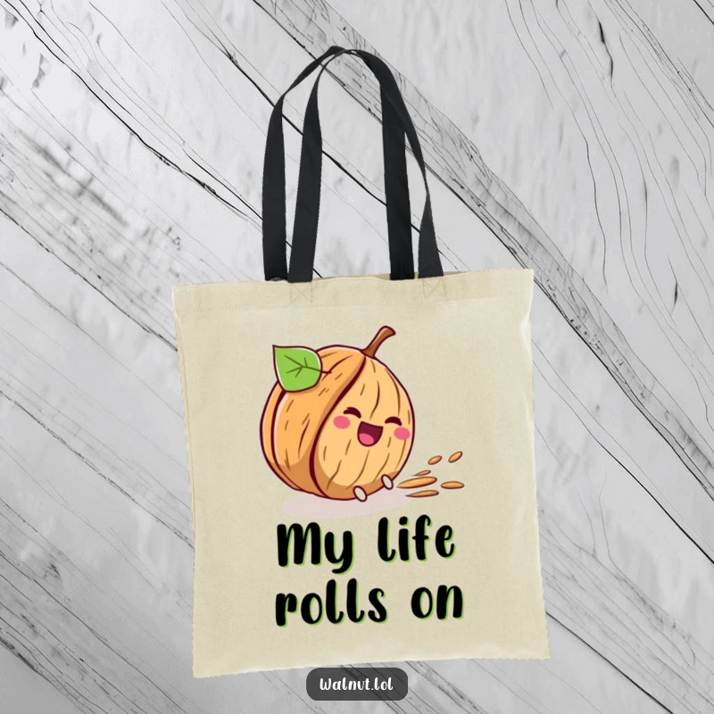 Funny tote bag featuring a walnut character comically rolling down a hill, leaving a path of laughter symbols.